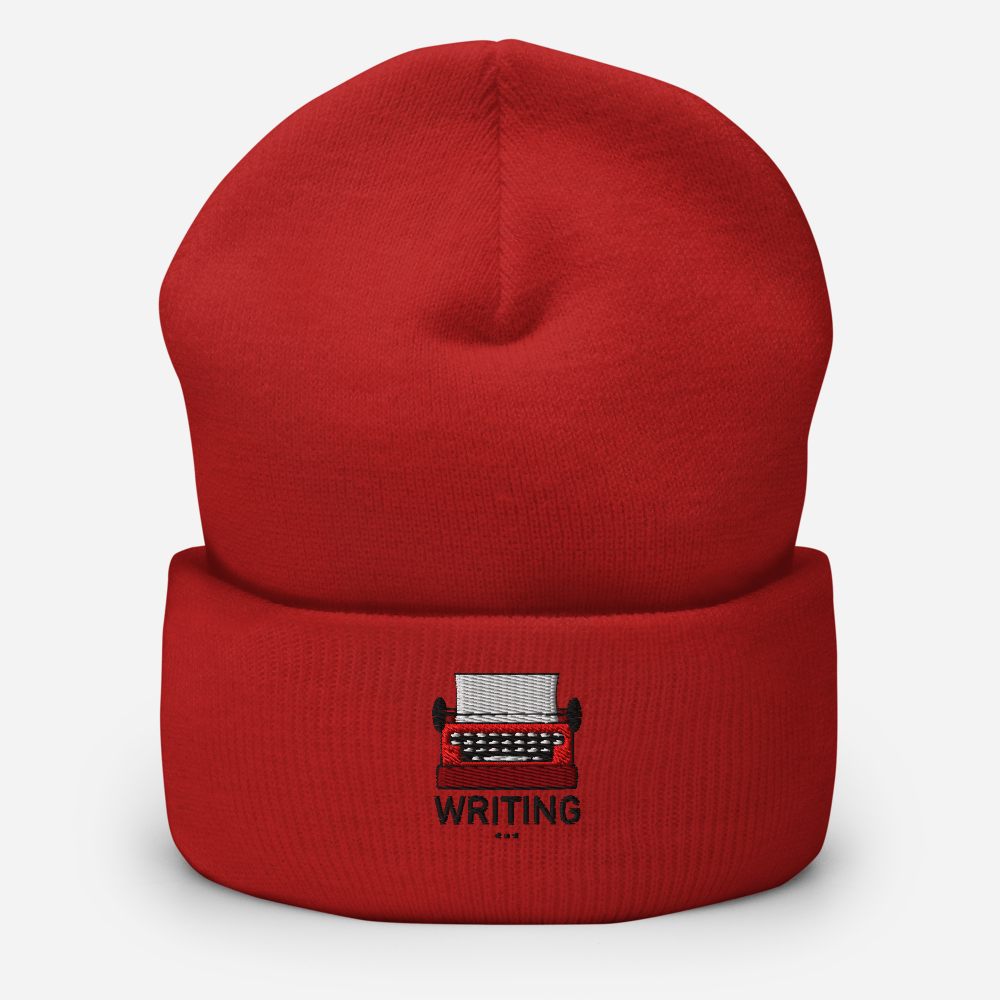 Red beanie with a typewriter and 'WRITING' embroidery on a white background