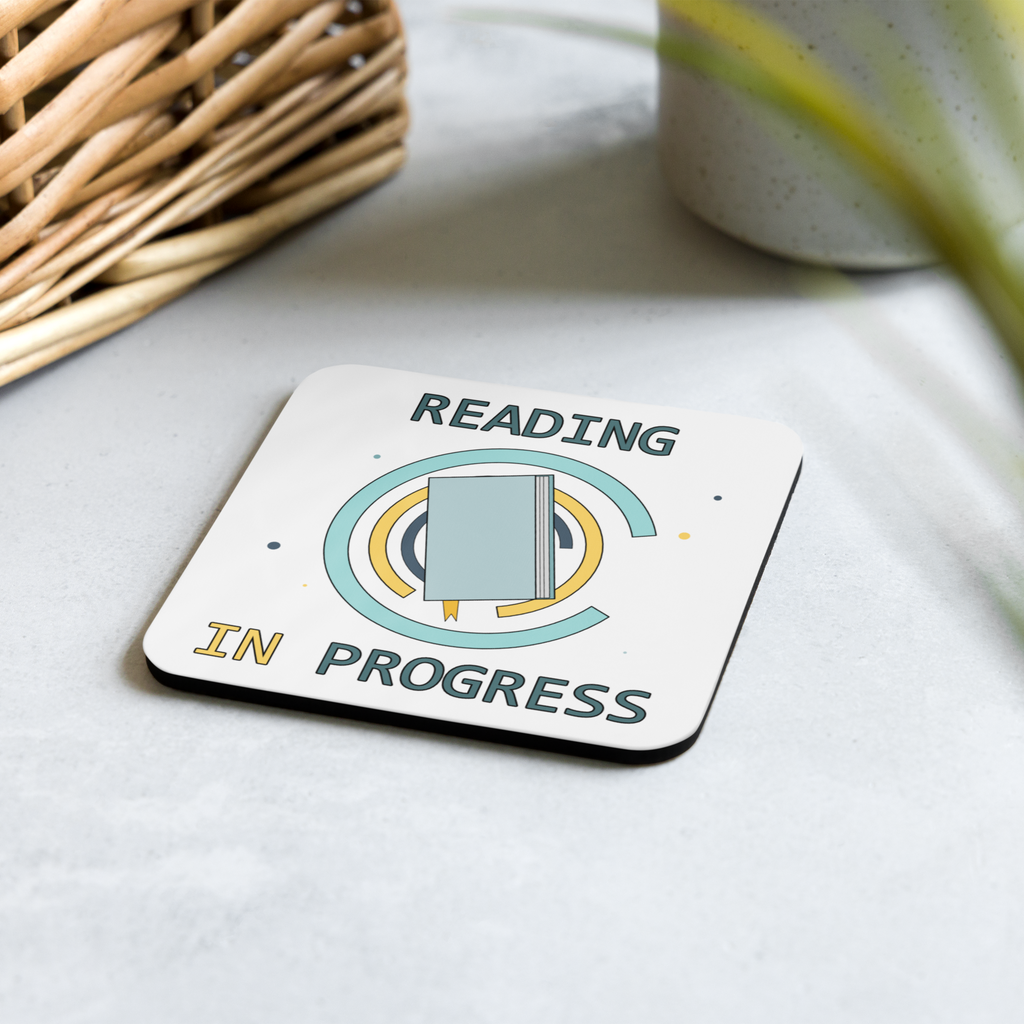 Coaster with 'Reading in Progress' design on a light surface