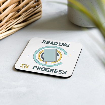 Coaster with 'Reading in Progress' design on a light surface